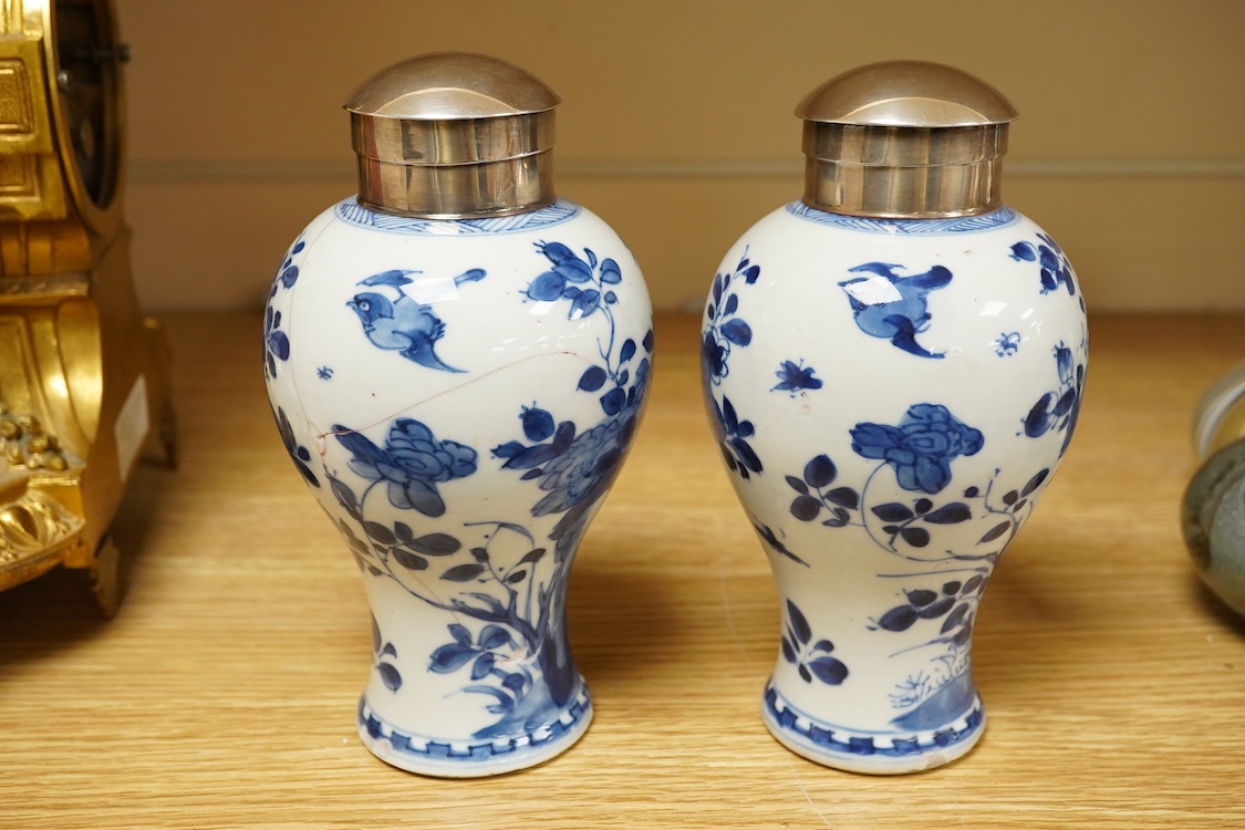 A pair of Chinese white metal mounted blue and white vases, Kangxi period (1662-1722), 16.5cm